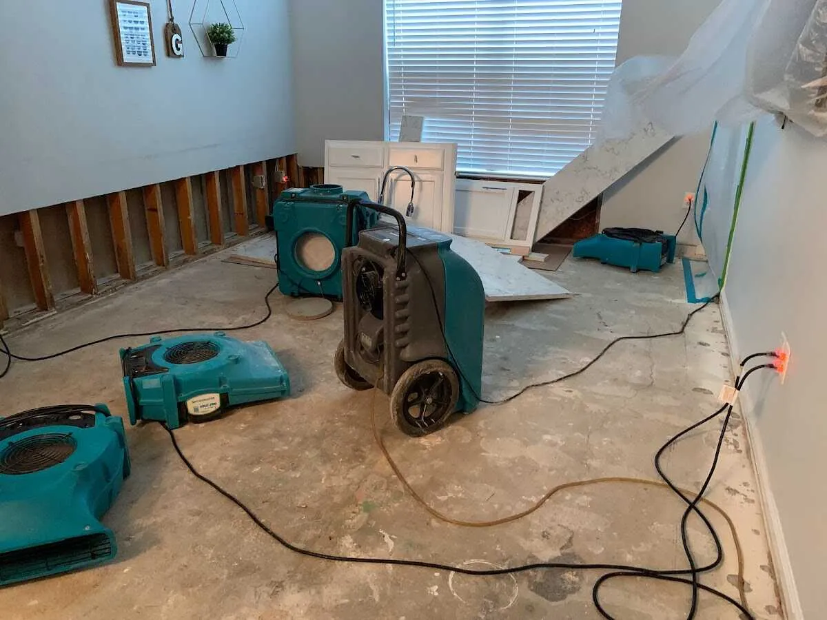 Dehumidifier in flood-cut room for Water Damage Restoration in Spencer